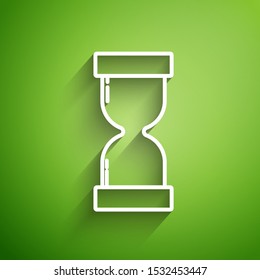 White line Old hourglass with flowing sand icon isolated on green background. Sand clock sign. Business and time management concept.  Vector Illustration
