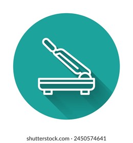 White line Paper cutter icon isolated with long shadow. Green circle button. Vector