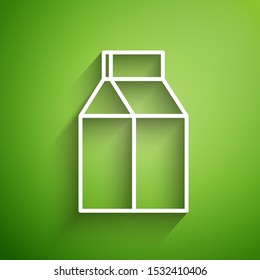 White line Paper package for milk icon isolated on green background. Milk packet sign.  Vector Illustration