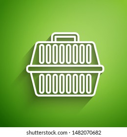 White line Pet carry case icon isolated on green background. Carrier for animals, dog and cat. Container for animals. Animal transport box.  Vector Illustration