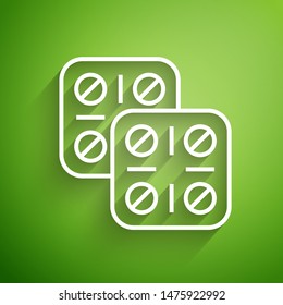 White line Pills in blister pack icon isolated on green background. Medical drug package for tablet: vitamin, antibiotic or aspirin.  Vector Illustration