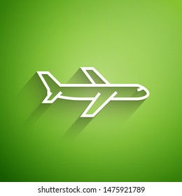 White line Plane icon isolated on green background. Flying airplane icon. Airliner sign.  Vector Illustration