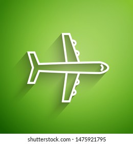 White line Plane icon isolated on green background. Flying airplane icon. Airliner sign.  Vector Illustration