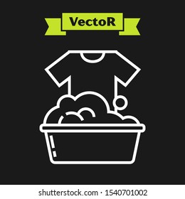 White line Plastic basin with soap suds icon isolated on black background. Bowl with water. Washing clothes, cleaning equipment.  Vector Illustration