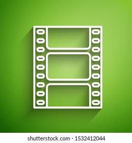 White line Play Video icon isolated on green background. Film strip sign.  Vector Illustration
