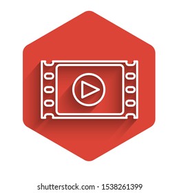 White line Play Video icon isolated with long shadow. Film strip with play sign. Red hexagon button. Vector Illustration