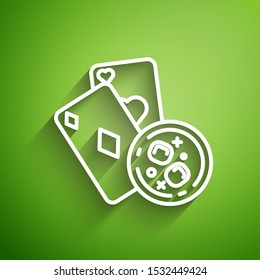 White line Playing cards and glass of whiskey with ice cubes icon isolated on green background. Casino gambling.  Vector Illustration