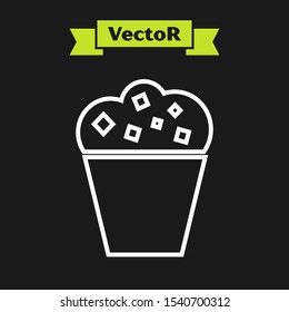 White line Popcorn in cardboard box icon isolated on black background. Popcorn bucket box.  Vector Illustration