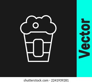 White line Popcorn in cardboard box icon isolated on black background. Popcorn bucket box.  Vector