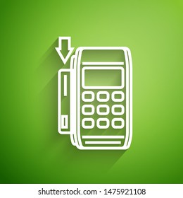 White line Pos terminal with inserted credit card icon isolated on green background. Payment terminal transaction. Pay by card.  Vector Illustration