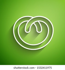White line Pretzel icon isolated on green background. German comfort food pastry. Oktoberfest festival.  Vector Illustration