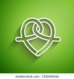 White line Pretzel icon isolated on green background. German comfort food pastry. Oktoberfest festival.  Vector Illustration