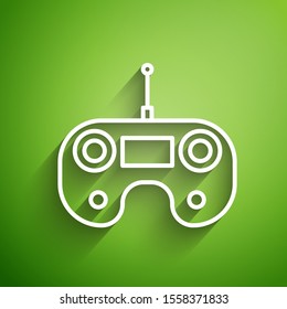 White line Remote control icon isolated on green background.  Vector Illustration