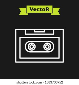 White line Retro audio cassette tape icon isolated on black background.  Vector Illustration