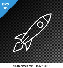 White line Rocket ship with fire icon isolated on transparent dark background. Space travel.  Vector Illustration