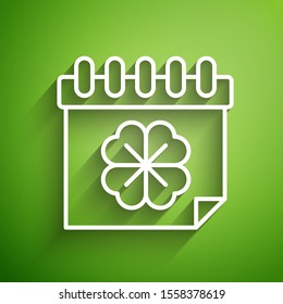 White line Saint Patricks day with calendar icon isolated on green background. Four leaf clover symbol. Date 17 March.  Vector Illustration