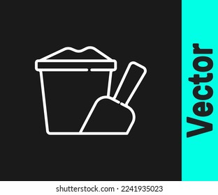White line Sand in bucket with shovel icon isolated on black background. Plastic kid toy. Summer icon.  Vector