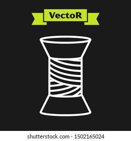 White line Sewing thread on spool icon isolated on black background. Yarn spool. Thread bobbin.  Vector Illustration