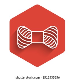 White line Sewing thread on spool icon isolated with long shadow. Yarn spool. Thread bobbin. Red hexagon button. Vector Illustration
