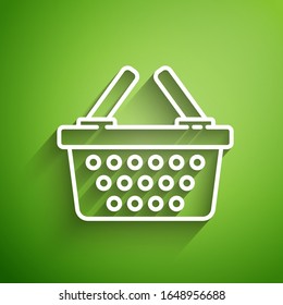 White line Shopping basket icon isolated on green background. Online buying concept. Delivery service sign. Shopping cart symbol.  Vector Illustration