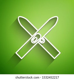 White line Ski and sticks icon isolated on green background. Extreme sport. Skiing equipment. Winter sports icon.  Vector Illustration