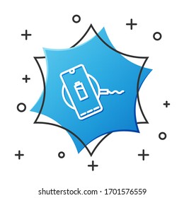 White line Smartphone charging on wireless charger icon isolated on white background. Charging battery on charging pad. Blue hexagon button. Vector Illustration