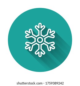 White line Snowflake icon isolated with long shadow. Green circle button. Vector Illustration