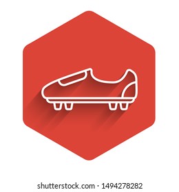 White line Soccer or football shoes with spikes icon isolated with long shadow. American football boot. Red hexagon button. Vector Illustration