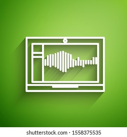 White line Sound or audio recorder or editor software on laptop icon isolated on green background.  Vector Illustration