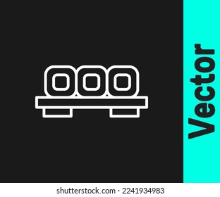 White line Sushi on cutting board icon isolated on black background. Asian food sushi on wooden board.  Vector