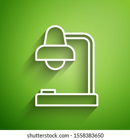 White line Table lamp icon isolated on green background. Table office lamp.  Vector Illustration