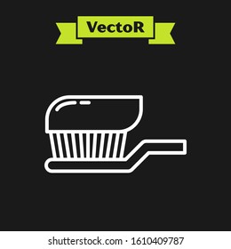 White line Toothbrush with toothpaste icon isolated on black background.  Vector Illustration