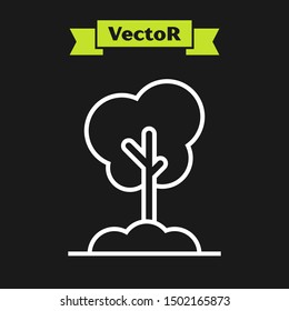 White line Tree in the ground icon isolated on black background. Forest symbol.  Vector Illustration