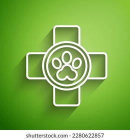 White line Veterinary clinic symbol icon isolated on green background. Cross hospital sign. Stylized paw print dog or cat. Pet First Aid sign.  Vector Illustration