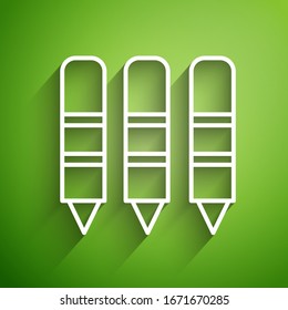 White line Wax crayons for drawing icon isolated on green background.  Vector Illustration