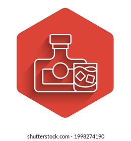 White line Whiskey bottle and glass icon isolated with long shadow. Red hexagon button. Vector