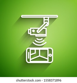 White line Wireless Controlling CCTV security camera with smartphone icon isolated on green background. IOT Concept and remote home appliance.  Vector Illustration