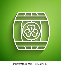 White line Wooden barrel with four leaf clover icon isolated on green background. Alcohol barrel, wooden keg for beer, whiskey, wine.  Vector Illustration