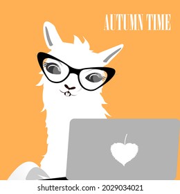 A white llama (alpaca) in black glasses works. A gray laptop with a white leaf. Orange background. The inscription "Autumn time". Distance learning and working at home.