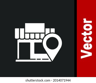 Ubicación blanca con el icono de la tienda aislado en el fondo negro.  Ilustración vectorial
