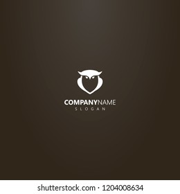 white logo on a black background. simple vector outline logo of owl bird shape