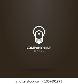 white logo on a black background. vector line art logo of house in a light bulb