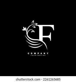 white luxury F letter logo with beautiful floral and feather ornament. feather logo. F typography, F monogram. Suitable for business logos, brands, companies, boutiques, beauty logos, etc