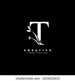 white luxury T logo design with beautiful floral and leaf ornament decoration. initial T letter logo. monogram T typography. feather logo