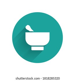 White Magic mortar and pestle icon isolated with long shadow. Green circle button. Vector Illustration