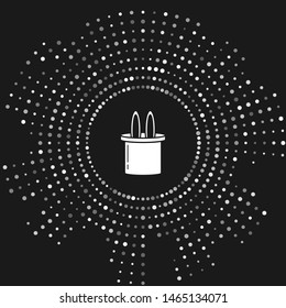 White Magician hat and rabbit ears icon isolated on grey background. Magic trick. Mystery entertainment concept. Abstract circle random dots. Vector Illustration