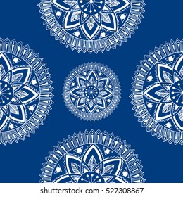 White mandala on blue background. Sketch.Seamless pattern. Vector image. Eastern flower. Coloring book pages, shapes, Wallpaper.