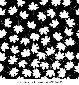white maple leaves on black background. vector seamless pattern