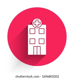 White Medical hospital building with cross icon isolated with long shadow. Medical center. Health care. Red circle button. Vector Illustration