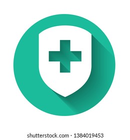 White Medical shield with cross icon isolated with long shadow. Health protection concept. Safety badge icon. Privacy banner. Security label. Green circle button. Vector Illustration